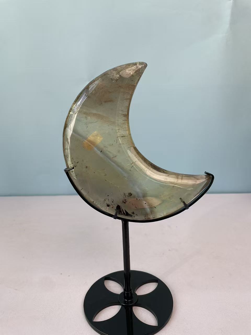 Natural yellow crystal in the shape of a moon crystal