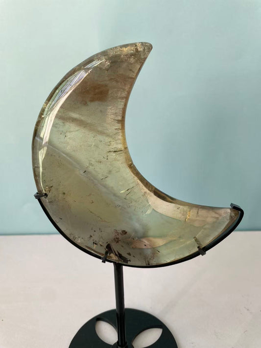 Natural yellow crystal in the shape of a moon crystal