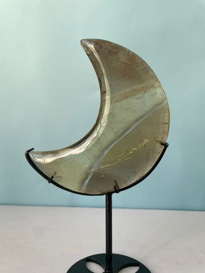 Natural yellow crystal in the shape of a moon crystal