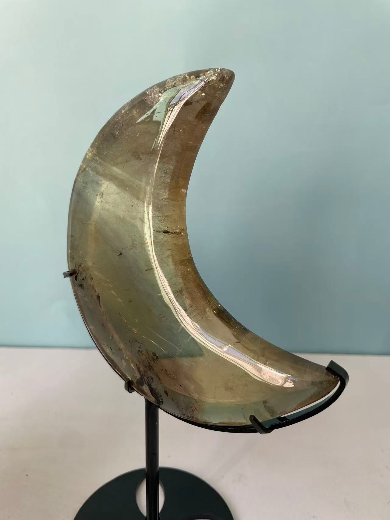 Natural yellow crystal in the shape of a moon crystal